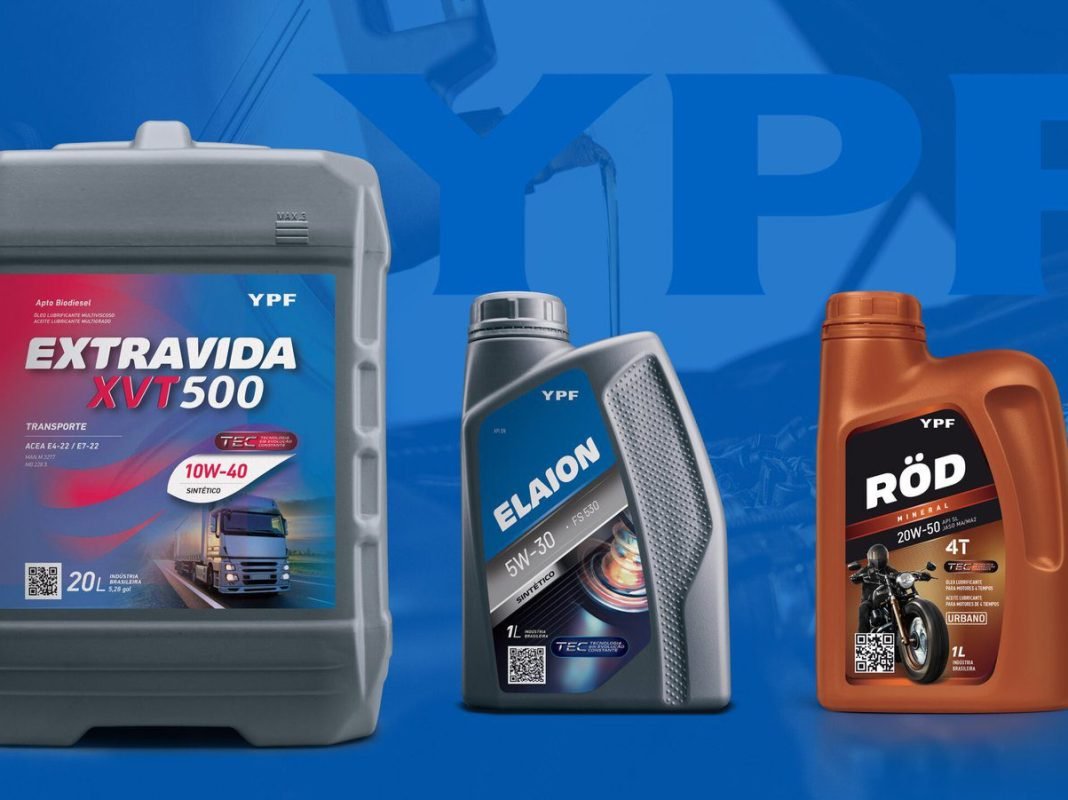 Mechanic fills up the engine with engine oil / oil service